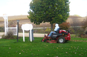 Mowing the lawn at the dog boarding facility